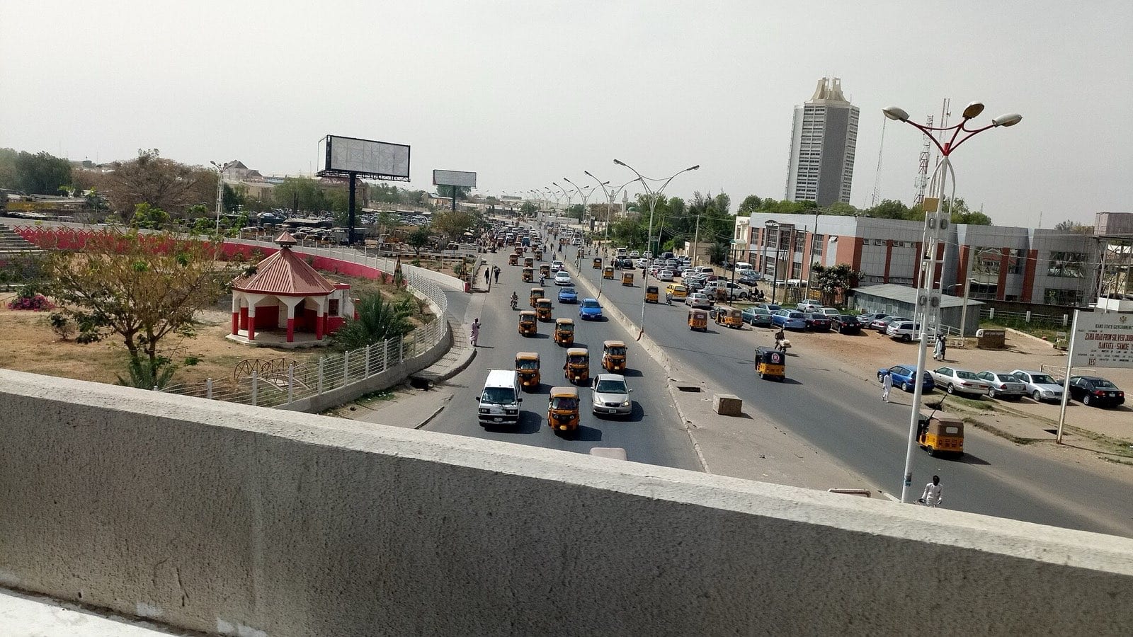 A wide view across the rooftops of Kano, seen from a bridge above the city.