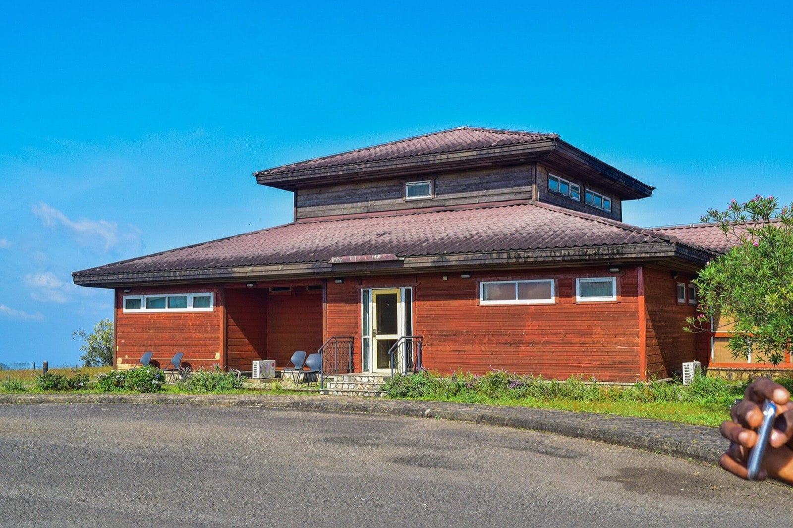 Hilltop lodges standing on the grassland at Obudu Cattle Ranch.