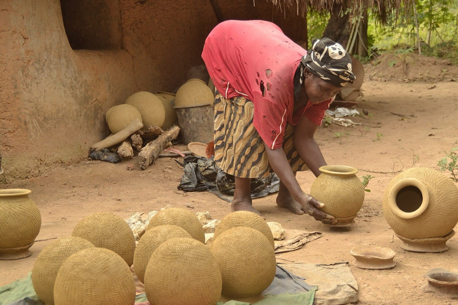 Finished clay pots standing in the sun to dry.