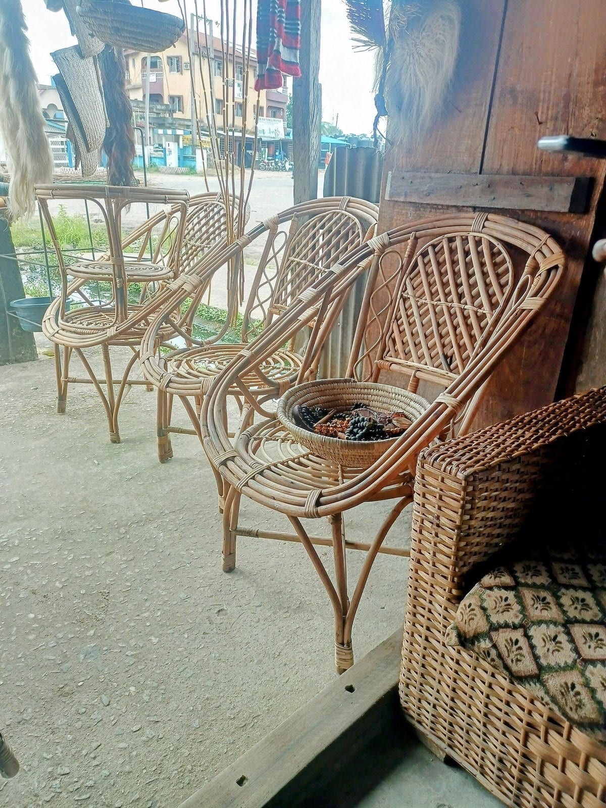 Chairs made from woven raffia standing in a workshop.