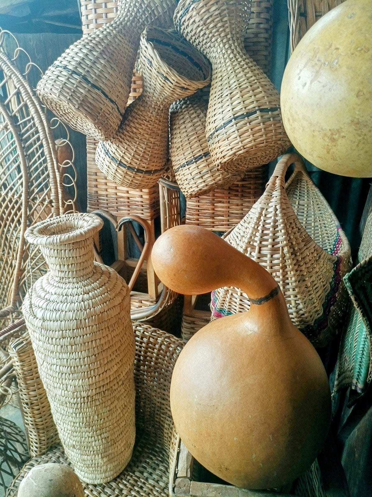 Palm wine jugs sleeved in woven raffia.